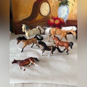 Assorted collection of toy horses some flocked